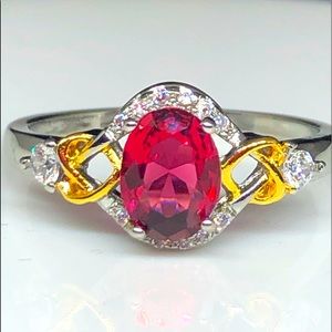 925/14kw Gold Two Tone Red Ruby Oval CZ Ring